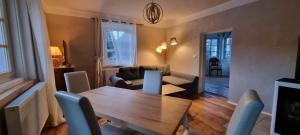 a living room with a table and a couch at Appartements Brigitte in Stadl an der Mur