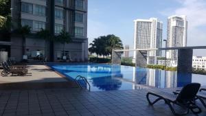 a swimming pool in the middle of a building at Shaftesbury Residences Cyberjaya Studio Suites Free Parking in Cyberjaya