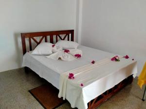 Postel nebo postele na pokoji v ubytování Candela Garden