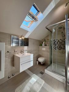 a bathroom with a sink and a shower and a toilet at House Bianca Brac - New Listing - Experienced host in Postira +30 photos
