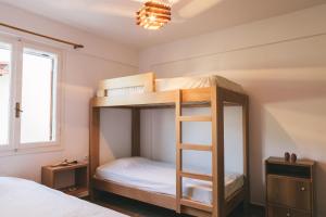 Poschodová posteľ alebo postele v izbe v ubytovaní Villa Melivia
