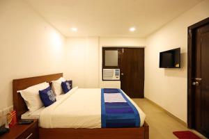 Voodi või voodid majutusasutuse Hotel O Ravin toas