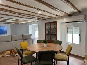 a living room with a table and a couch at Casa Kiona in Moratalla