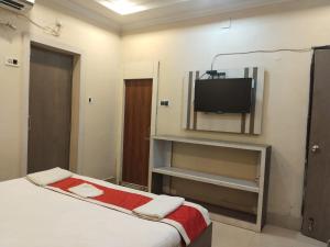 Postel nebo postele na pokoji v ubytování New Digha Royal SeaView