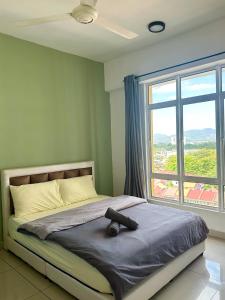 Ένα ή περισσότερα κρεβάτια σε δωμάτιο στο GA Homes Homestay - Majestic Ipoh Condo +55 φωτογραφίες