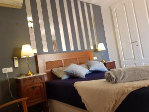 Letto o letti in una camera di CASA BELLE VUE sea view & private pool