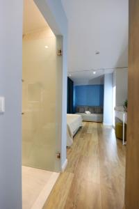 a room with a bed and a sliding glass door at Veranda Boutique Hotel 1 in Vlorë