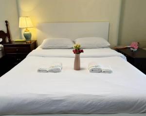 Apamet Hotel Sukhumvit 55客房内的一张或多张床位