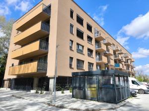 a building with a glass booth in front of it at modern apartment in Senica