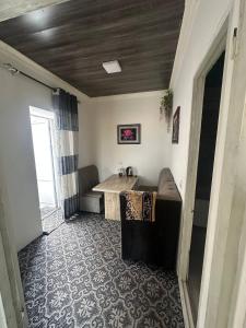 a living room with a couch and a table at Family hostel Toshkent in Toshkent-Passajir Bekati