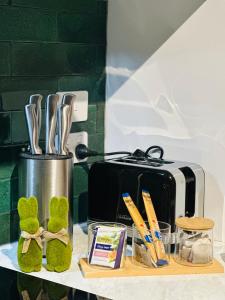 a counter with a toaster on a counter top at Natural & Relax House in West Ulverstone in Ulverstone