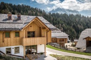 a house under construction with a mountain in the background at Mountain Chalet Pia in La Valle