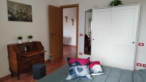 Postel nebo postele na pokoji v ubytování L'Arco nel Borgo