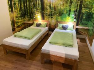 Postel nebo postele na pokoji v ubytování Azuria Schwarzwald Loft