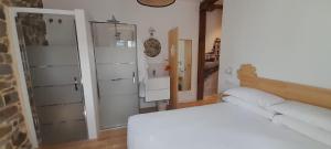 a bedroom with a white bed and a dresser at Bellavista Room Bakio in Bakio