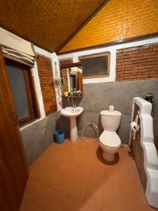 a bathroom with a toilet and a sink at The Nest, Pai Love Resort in Thung Yao +65 photos