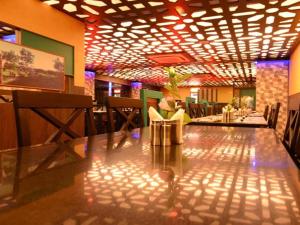 a dining room with a long table and chairs at Hotel Rockfort View by Park Elanza in Tiruchirappalli