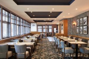 a dining room with tables and chairs at Leonardo Inn Aberdeen Airport in Dyce +17 photos