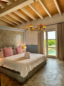 A bed or beds in a room at Finca Hotel Rural Es Turó Még 37 kép
