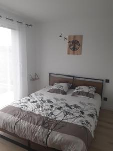 Katil atau katil-katil dalam bilik di Studio indépendant chez l'habitant