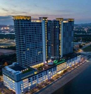 an aerial view of a large building at night at 4-6pax Seaview Condo 5min Kuantan town in Kuantan +34 photos
