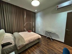 a bedroom with a bed and a television on the wall at Kuching Rex 2 bedrooms for 4 pax in Kuching +19 photos