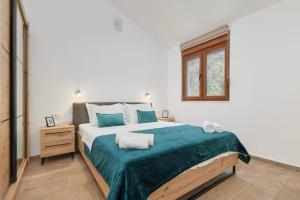 Ένα ή περισσότερα κρεβάτια σε δωμάτιο στο Apartmani Nadja