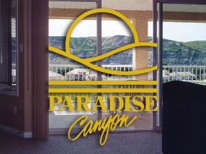 a yellow sign on the window of a restaurant at Paradise Canyon Golf Resort - Signature Villa 382 in Lethbridge