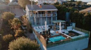 an aerial view of a house with a swimming pool at Clanwilliam Dam House in Clanwilliam