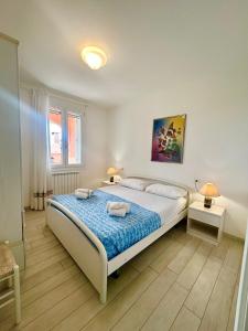 Ένα ή περισσότερα κρεβάτια σε δωμάτιο στο Garden retreat by the sea on Albarella