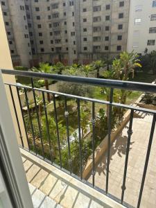 a balcony with a view of a city at Luxury suite jardin de Carthage in Sidi Daoud