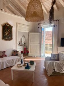 a living room with a couch and a table at Tra Vicoli e Palazzi Apartment in Tropea