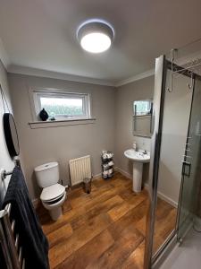 a bathroom with a toilet and a sink at Firdale in Fort William +45 photos