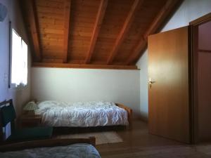 Łóżko lub łóżka w pokoju w obiekcie Rustico Nocciolo
