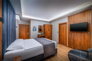 Uma TV ou centro de entretenimento em Elite Hotels Istanbul Airport