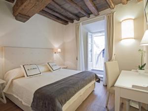 Postelja oz. postelje v sobi nastanitve B&B Il Corso