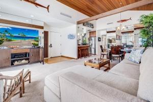 a living room with a couch and a dining room at Wailea Elua, #1402 in Wailea +37 photos