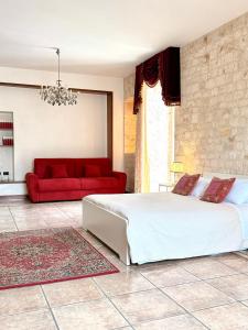 Ένα ή περισσότερα κρεβάτια σε δωμάτιο στο Ferrari 44 - Dimora di Puglia