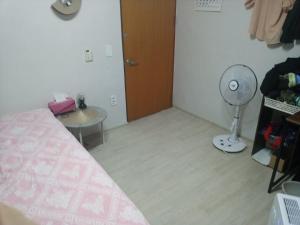 Postel nebo postele na pokoji v ubytování Ocean House - Ipjang