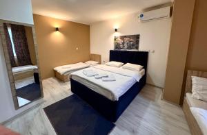 Postel nebo postele na pokoji v ubytování Hotel Alisa