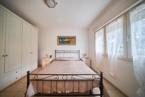 Ένα ή περισσότερα κρεβάτια σε δωμάτιο στο APPARTAMENTI Il rosmarino