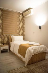 Postel nebo postele na pokoji v ubytování Hotel Alisa