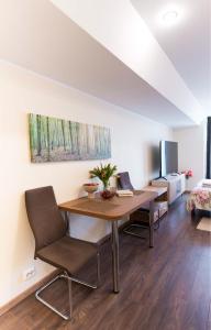 a room with a table and chairs and a bed at Your city apartment. in Tallinn
