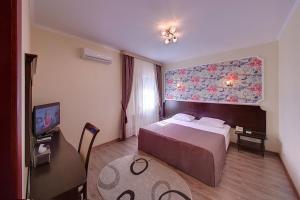 Voodi või voodid majutusasutuse Country Club Aivengo Hotel Jungle toas
