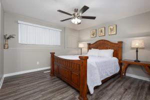 a bedroom with a bed and a ceiling fan at Paradise Canyon Golf Resort - Signature Walkout Condo 380 in Lethbridge