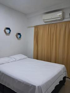 Postel nebo postele na pokoji v ubytování Apartaestudio Norte de Neiva