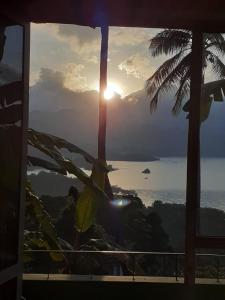 a view of the ocean from a room with a window at Green nature inn villa in Digana