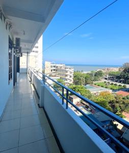 a balcony of a building with a view of the ocean at Khách Sạn Mai Hà Sầm Sơn in Sầm Sơn