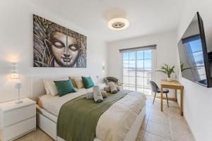 TV a/nebo společenská místnost v ubytování Summervibe Sea View Apartment