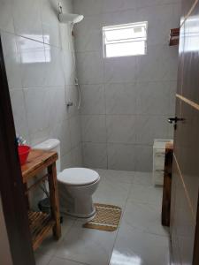 a small bathroom with a toilet and a shower at Juazeiro do Norte CE Sao Jose in Juazeiro do Norte
